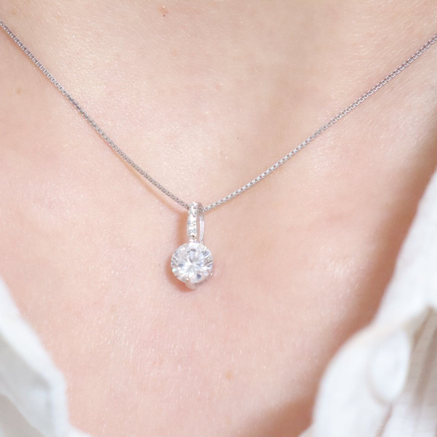 Delicate solid silver with zirconia pendant