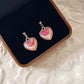 Gold Dangling Heart Earrings, pink reflective ‘fish scale’ effect
